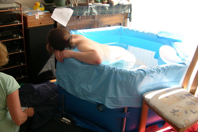 pregnant woman in birth pool during labour